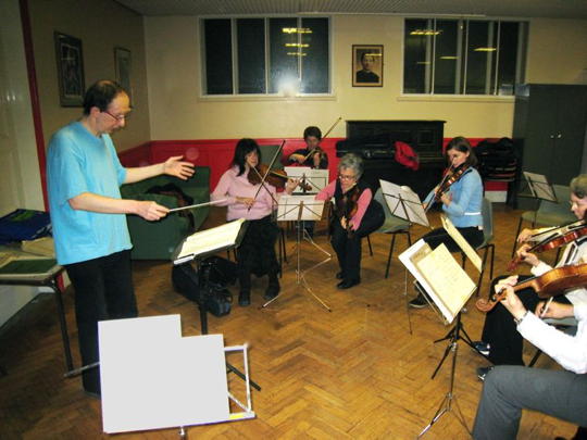 Keith Bramich conducting the orchestra in 2009